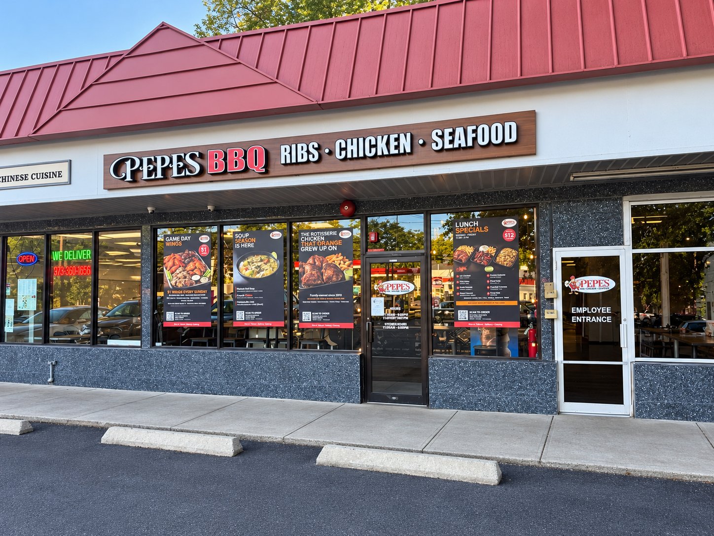 Pepe's BBQ storefront today on Pleasant Valley Way in West Orange, NJ, with the Ribs, Chicken, Seafood sign and window posters